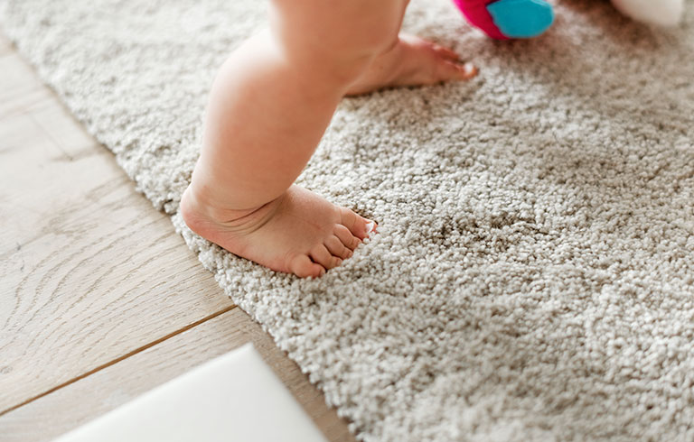 baby walking on synthetic type of rug singapore